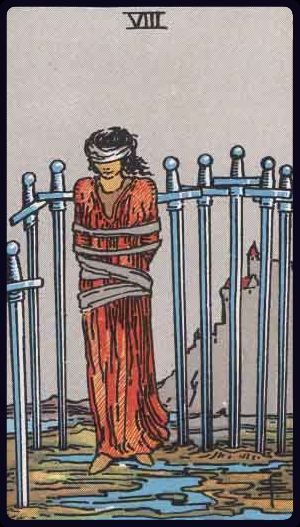 acht der schwerter tarot bedeutung: gebundene, blind gefaltete Figur von Schwertern umgeben – Blockade, Angst, Perspektivwechsel nötig.